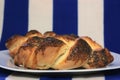 Two pieces of bread front of blue white cloth