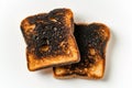 Two pieces of burnt toast isolated on transparent or white background, png, created by Generative AI