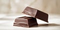Two pieces of chocolate stacked on top of each other. Royalty Free Stock Photo