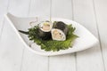 Two pieces of fat maki stuffed with duck rolled with nori seaweed, Royalty Free Stock Photo