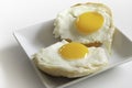 Two pieces of fried sunny side eggs on English Muffins Royalty Free Stock Photo