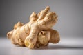 Two pieces of ginger root close-up on a gray background. Generative AI Royalty Free Stock Photo
