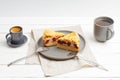 Two pieces of homemade cherry pie with crumbs on top and two cups with coffee and tea Royalty Free Stock Photo