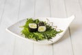 Two pieces of maki stuffed with chopped cucumber wrapped in nori Royalty Free Stock Photo