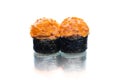 Two pieces of Maki sushi roll with Salmon isolated on white background with reflection Royalty Free Stock Photo