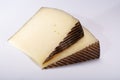 Two pieces of Manchego, queso manchego, cheese made in La Mancha region of Spain from the milk of sheep of the manchega breed, is Royalty Free Stock Photo