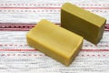 Two pieces of the natural handmade organic olive oil soap on the wooden table. Rustic background. Bath spa accessories. Table doil Royalty Free Stock Photo