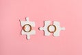 Two Pieces Of Paper Jigsaw Puzzles With Golden Wedding Rings Isolated On Pink Background, Top View