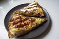 Two pieces of pizza on a plate Royalty Free Stock Photo