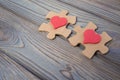 Two pieces of a puzzle with a red heart, unite into a single whole. Holiday, St. Valentine`s Day Royalty Free Stock Photo