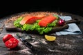 Two pieces of smoked fish Pink salmon on shale board. Fish close up. Royalty Free Stock Photo