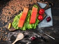 Two pieces of smoked fish Pink salmon on shale board. Fish close up. Royalty Free Stock Photo