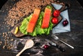 Two pieces of smoked fish Pink salmon on shale board. Fish close up. Royalty Free Stock Photo