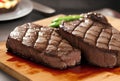 Two pieces of steaks grilled on wooden chopping board