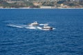 Two Pilot Boats Circling in Blue Water Royalty Free Stock Photo