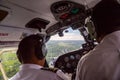 Two pilots landing a small aircraft to Nausori airport airstrip near Suva, Fiji, Melanesia, Oceania. Air travel in Fiji, cockpit.