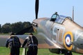 Two pilots pushing second world war hurricane fighter plane