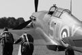 Two pilots pushing second world war hurricane fighter plane