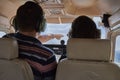 Two pilots sitting in a cockpit of cessna skyhawk 172 airplane.