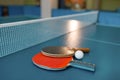 Two ping pong paddles on the table with net Royalty Free Stock Photo