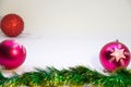 Two pink balls, one red ball, Christmas decorations Royalty Free Stock Photo