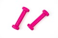 Two pink dumbbells isolated on white Royalty Free Stock Photo