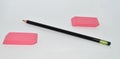 Two pink erasers a pencil on a white background Royalty Free Stock Photo
