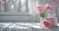 two pink flowers in a vase and gifts on white wood Royalty Free Stock Photo