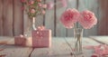 two pink flowers in a vase and gifts on white wood Royalty Free Stock Photo