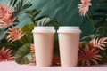 Two pink paper coffee cups with green and pink leaves in the background. Minimalism concept Royalty Free Stock Photo