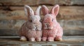 Two pink plush rabbits on rustic wooden background. Easter and springtime decoration concept Royalty Free Stock Photo