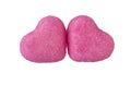 two pink sugar hearts on a white background close-up Royalty Free Stock Photo