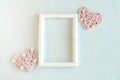 Two pink thread handmade hearts and photo frame on white background. Template for ValentineÃ¢â¬â¢s Day greeting card. Royalty Free Stock Photo