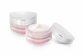 Two pink triangle cosmetic jar on isolated