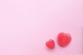 Two Pink Valentine`s day heart shape candy on empty pastel pink paper background. Love Concept. top view. Minimalism colorful