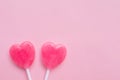 Two Pink Valentine`s day heart shape lollipop candy on empty pastel pink paper background. Love Concept. top view. Royalty Free Stock Photo