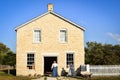 Two Pioneer Women Entering Stone Building