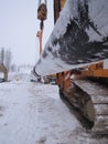 Two pipelayers move a pipe