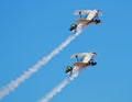 Two Pitts aerobatic aircraft in a formation climb