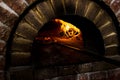 Two pizza in a wood burning oven Royalty Free Stock Photo