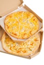 Two pizzas in a cardboard box with cheese, and the second with cheese and chicken. Pizza isolated Royalty Free Stock Photo