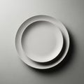 Two plain, white ceramic plates are Royalty Free Stock Photo