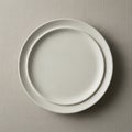 Two plain, white ceramic plates are Royalty Free Stock Photo
