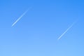 Two planes in the sky flying synchronously Royalty Free Stock Photo
