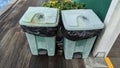 Two plastic bins that looked old and dirty