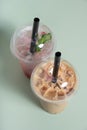 Two plastic glasses with bubble tea and ice angle view. Trendy summer drinks Royalty Free Stock Photo
