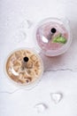 Two plastic glasses with bubble tea and ice top view. Trendy cold summer drinks Royalty Free Stock Photo