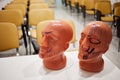 Two plastic models of human head with cosmetology