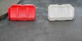Two plastic road barriers