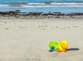 Two plastic sand pails with shovels on a sandy beach Royalty Free Stock Photo